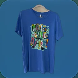 A blue T-shirt with a colorful graphic print, on a hanger